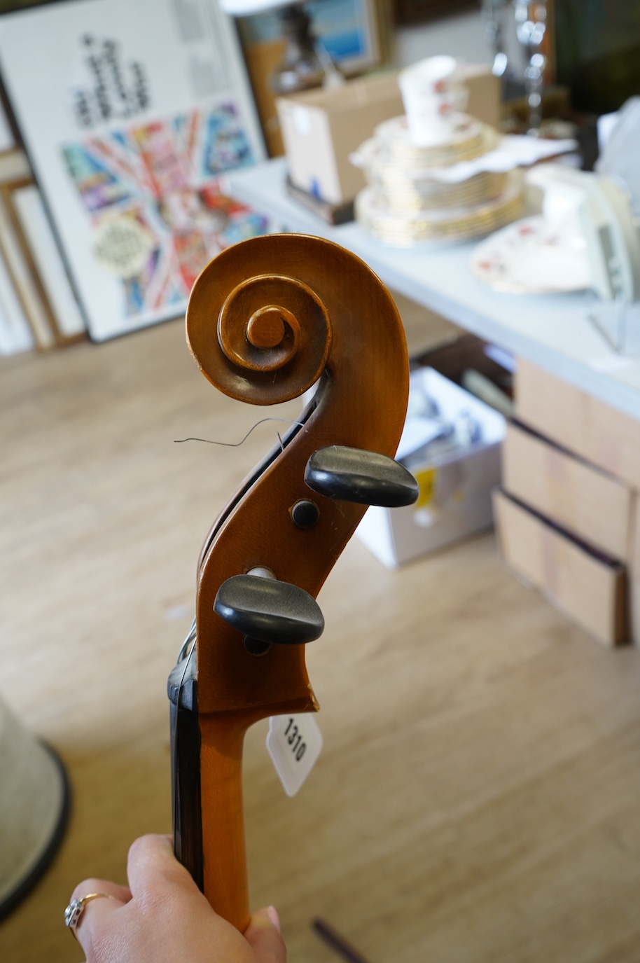 A student’s Golden Strad ‘cello imported by Boosey and Hawkes, body 69.5cm and violin, body 36cm, and a wooden conductors baton. Condition - poor to fair